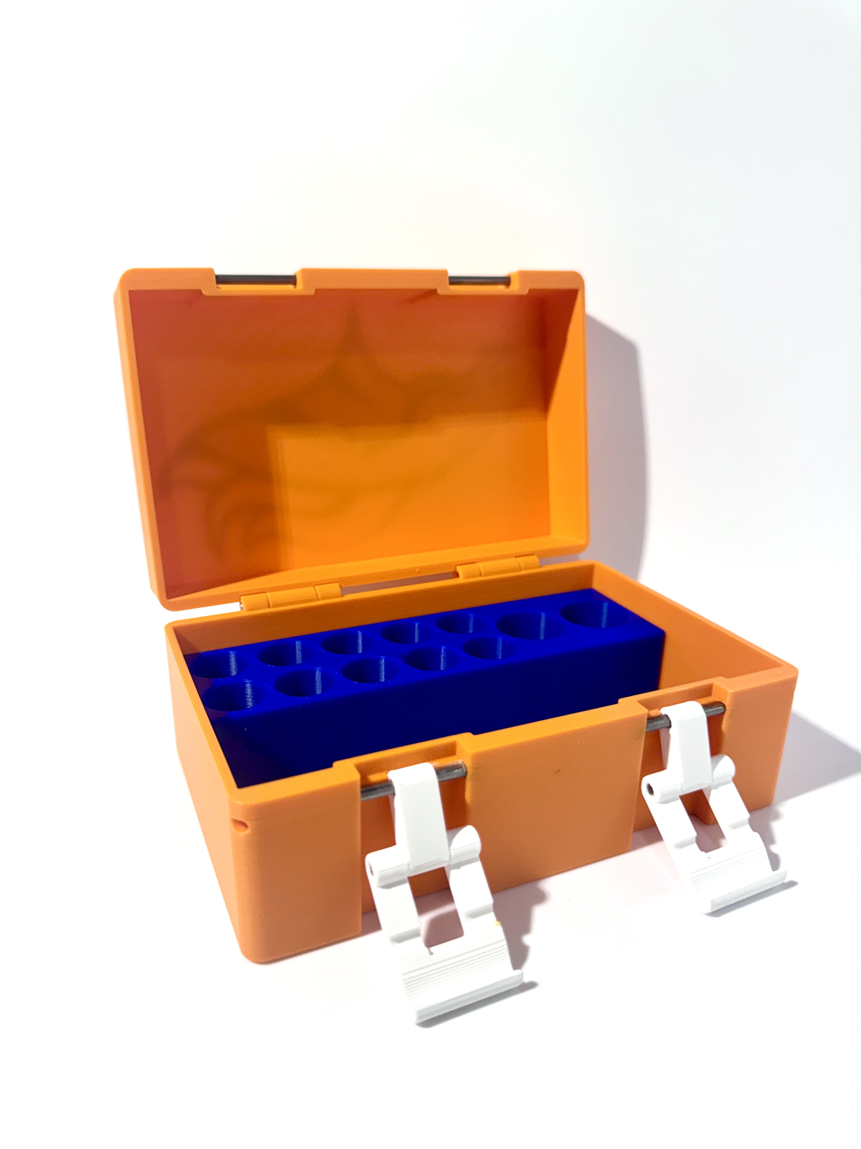 Bright orange vial box open with blue vial inserts